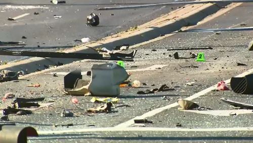 Police spent much of the day cleaning up debris from the crash.