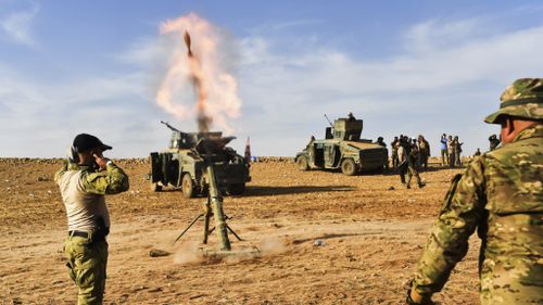 Iraqi forces fire mortar shells at ISIS jihadists. (AFP)