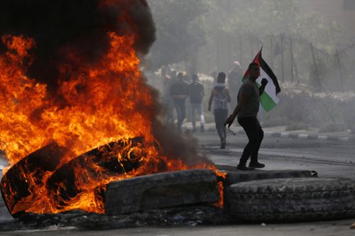 Palestinians clash with Israeli forces after a rally to mark the 70th anniversary of what they call their "nakba". Picture: EPA
