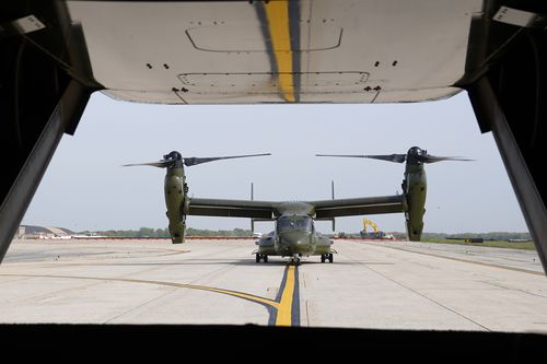 A U.S. Marine Corps Osprey aircraft taxies behind an Osprey carrying members of the White House press corps at Andrews Air Force Base, Md., on April 24, 2021. 