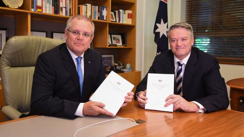 Scott Morrison and Mathias Cormann unveil the MYEFO today. (AAP)