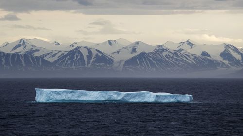 In this July 24, 2017, file photo, an iceberg floats past Bylot Island in the Canadian Arctic Archipelago.