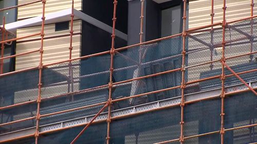 Workers are believed to have been injured by scaffolding surrounding the site.