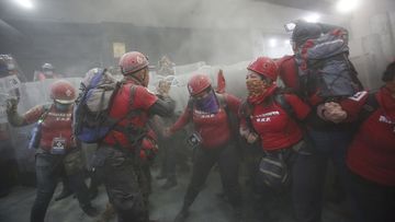 Protesters in Mexico City are pepper-sprayed.