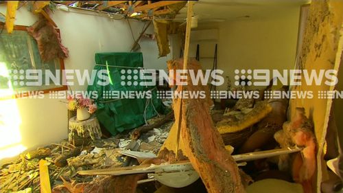 Resident Lorraine Travers' house was severely damaged when a tree crashed into her living room. (9NEWS)