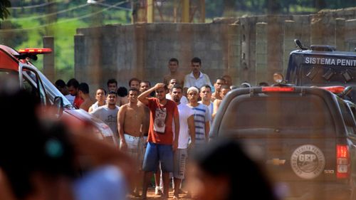 Prisoners try to contact relatives after a rebellion at the Colonia Agroindustrial prison in the Aparecida de Goiania Complex. (AP)