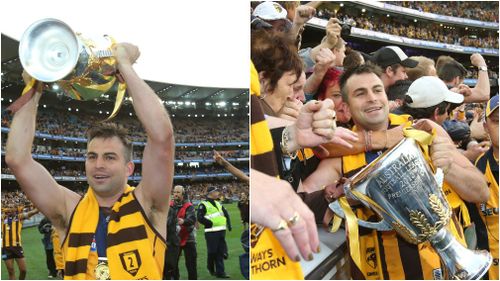 Lake with the premiership cup after winning the Grand Final with the Hawks in 2013. (AAP)