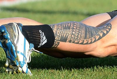 The hulking dual international has also gone with ink on his arms and legs. (Getty)