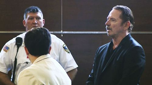 Actor Tom Wopat stands during arraignment Thursday, Aug. 3 on indecent assault and battery and drug possession charges. (AAP)