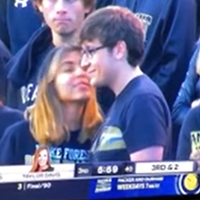 Man goes viral for rejecting woman on kiss cam at college football game.
