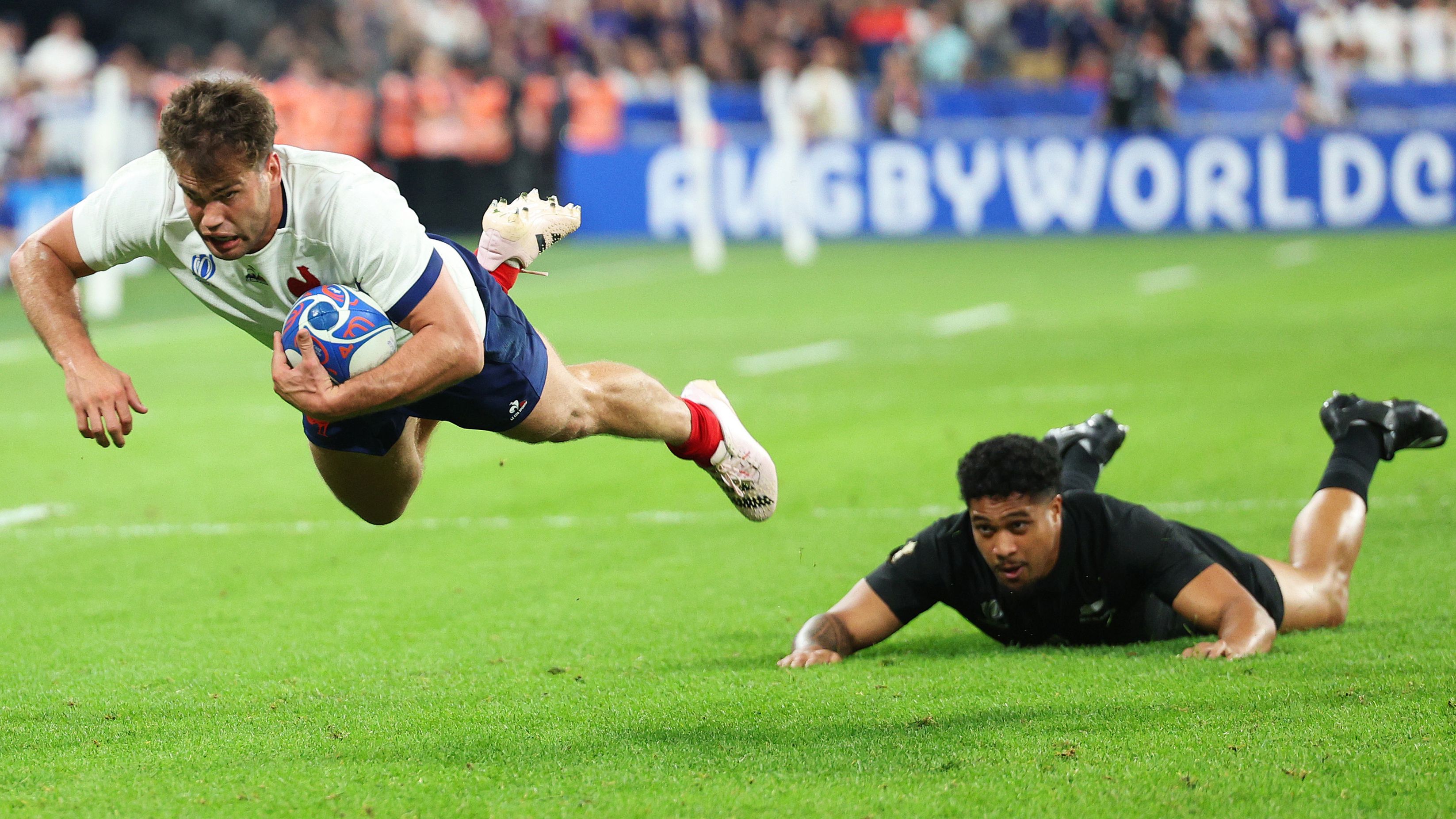 Damian Penaud of France breaking for the try line.