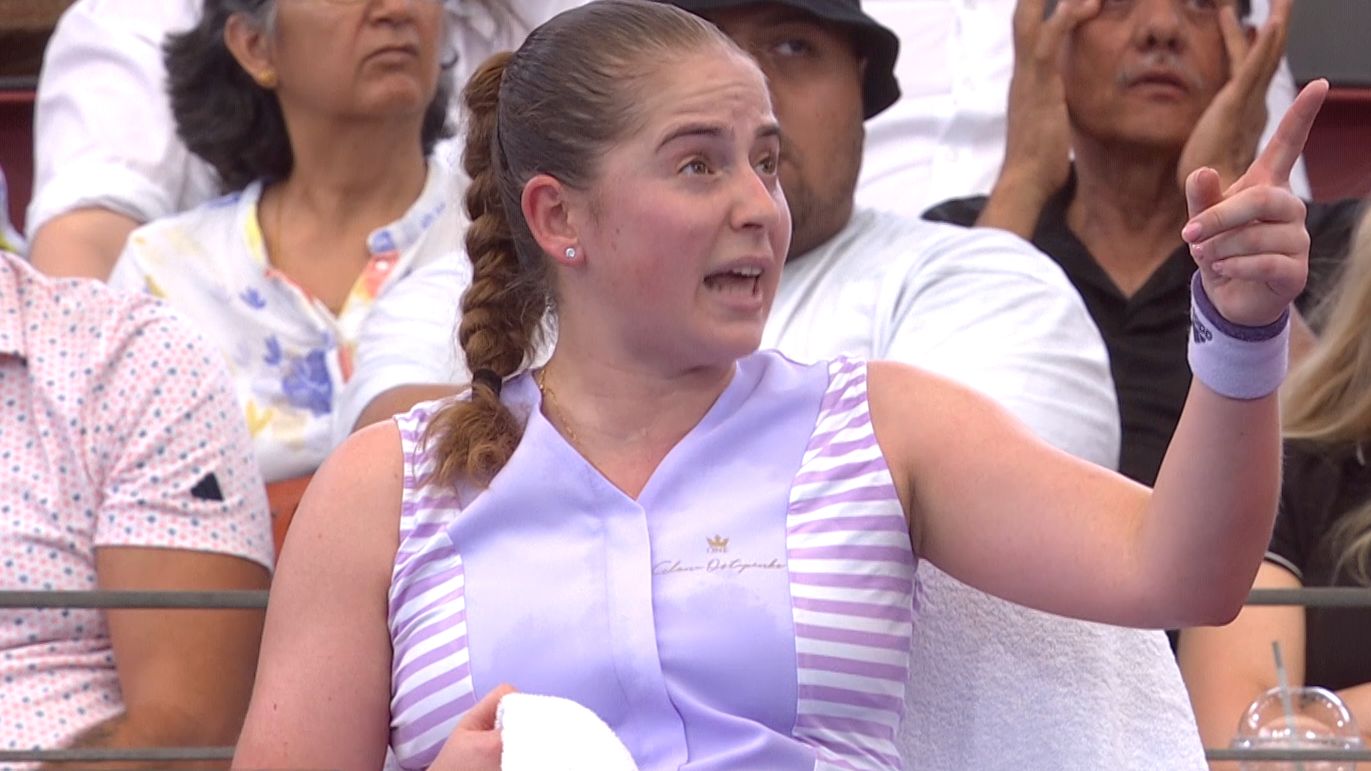 Jelena Ostapenko argues with the chair umpire after a call did not fall in her favour.