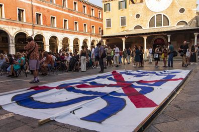 People participate in the protest against the wedding of Jeff Bezos in Venice, Italy, on June 13, 2025 