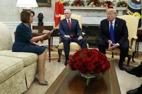 Nancy Pelosi (left) argues with Donald Trump (right) as Mike Pence looks on during a White meeting on December 11, 2018.  