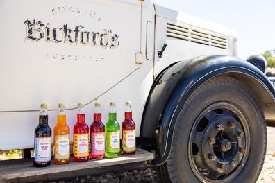 A truck with a Bickford's logo on it has six bottles of the company's limited edition drink flavours resting on it.