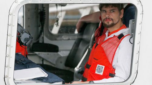 Nathan Carman arrives in a small boat at the US Coast Guard station, in Boston in 2016 after spending a week at sea.