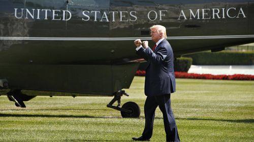 President Trump waves to visitors to the White House on Aug. 4, 2017. Photo: AP