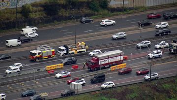 Over-height truck stops southbound traffic before Sydney Harbour Tunnel on Tuesday morning.