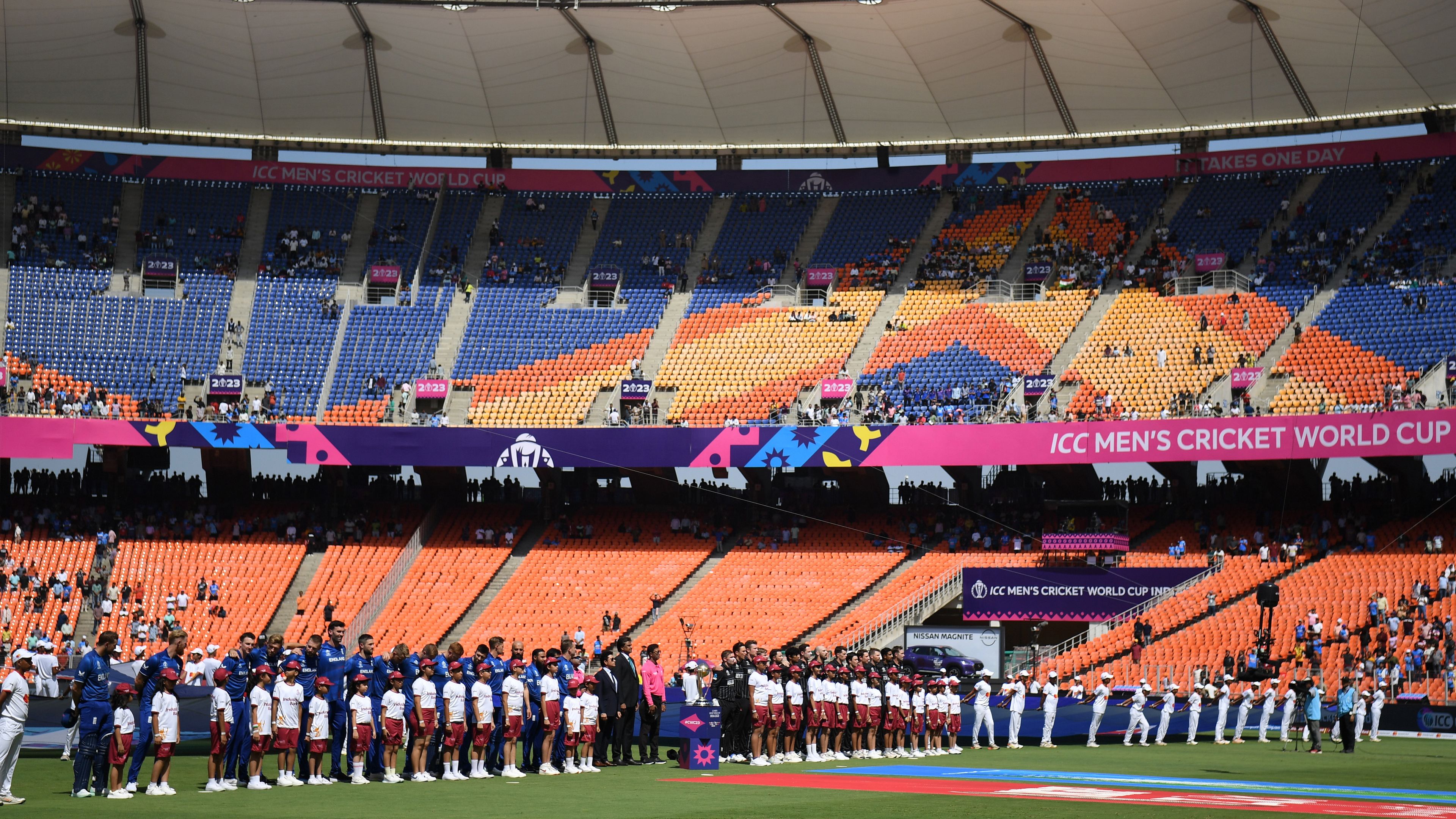 AHMEDABAD, INDIA - OCTOBER 05: Players of England and New Zealand line up for the National Anthems ahead of the ICC Men&#x27;s Cricket World Cup India 2023 between England and New Zealand at Narendra Modi Stadium on October 05, 2023 in Ahmedabad, India. (Photo by Gareth Copley/Getty Images)