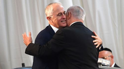 Australian Prime Minister Malcolm Turnbull (left) and Israeli Prime Minister Benjamin Netanyahu embrace during a welcome ceremony