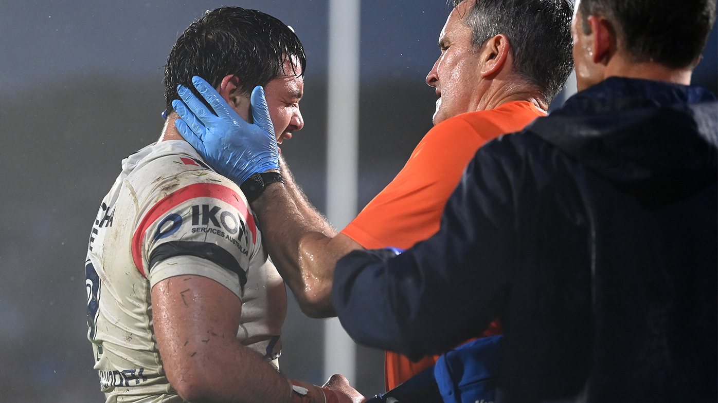 Brandon Smith is taken off for a concussion assessment during the round nine NRL match between the New Zealand Warriors and the Sydney Roosters.