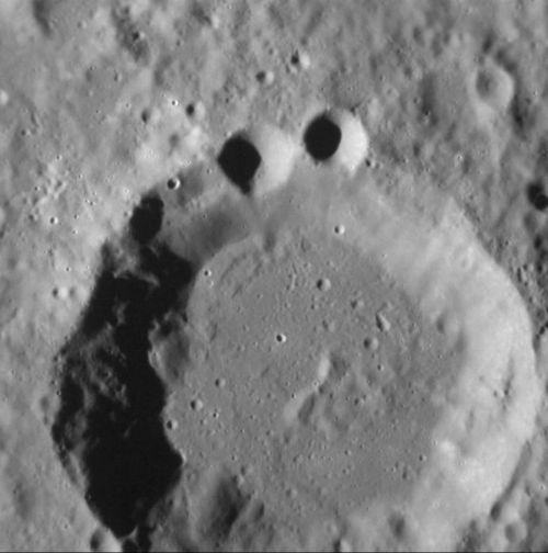 An impact crater on Mercury bears a more than passing resemblance to popular children's character Cookie Monster. (Supplied)