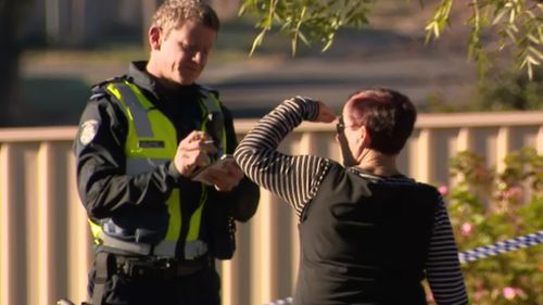 Police at the scene of the alleged murder on Monday. (9NEWS)