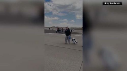 those on board were evacuated on the runway, according to American Airlines and Denver International Airport.