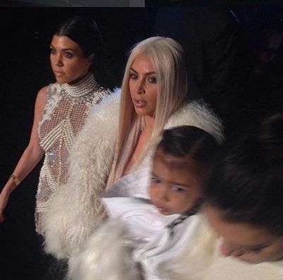 Kim Kardashian-West and North West wore matching white fur coats.