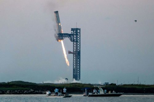 	Huge metal pincers grapple Starship's Super Heavy booster as it returns to the launchpad in Starbase near Brownsville, Texas, after the October 13 test flight. The maneuver was a first in SpaceX's quest to make the rocket reusable.