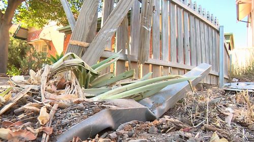 The car had crashed into the fence of a home.