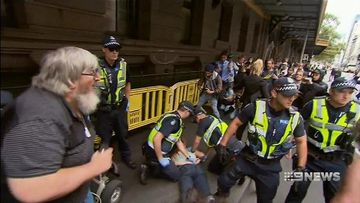 Arrests and anger as police move homeless from Melbourne camp