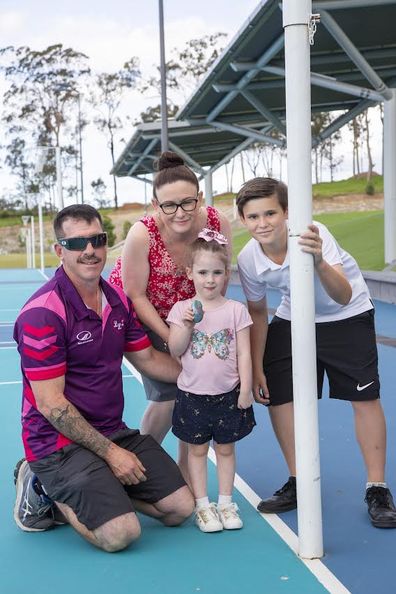 The Mitchell family at a rock painting event to promote World Day of Remembrance for Road Traffic Victims at Coomera Netball courts, Pimpama. 