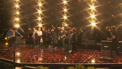 Jimmy Barnes leads the closing song at Michael Gudinski's state memorial