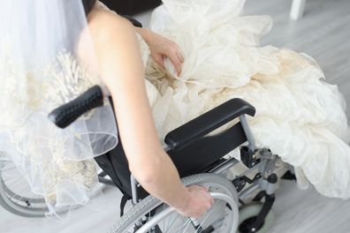 Bride, who is a wheelchair user, in wedding dress