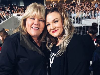 Carly Heading poses with Taylor Swift's mother Andrea at one of her Reputation shows in 2018.