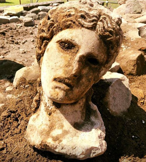 Ancient marble head of ‘fertility god’ unearthed in Rome
