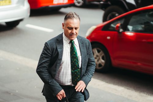 Former TV presenter Andrew OKeefe arrives at Downing Centre Local Court for his hearing on assault charges, Wednesday 1st of November 2023.  Photo: Dion Georgopoulos / The Sydney Morning Herald