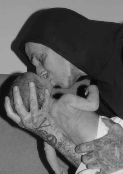 Travis Barker shared a sweet kiss with his newborn son.