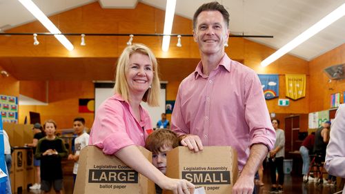 Chris Minns joins his wife Anna and children to cast their vote