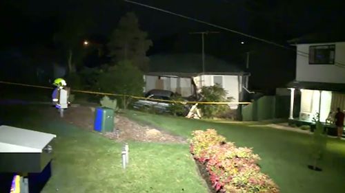 It is believed the car crashed into the house at high speed. (9NEWS)