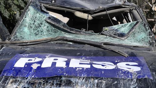 A destroyed journalists car is seen at the site where an Israeli airstrike hit a compound housing journalists, killing three media staffers from two different news agencies according to Lebanon's state-run National News Agency, in Hasbaya village, southeast Lebanon, Friday, Oct. 25, 2024. (AP Photo/Mohammed Zaatari)