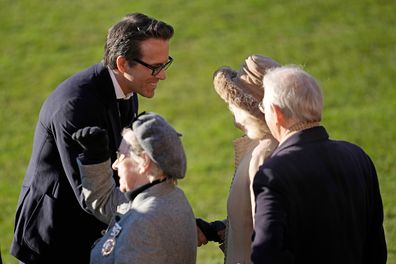 Co-Owner Wrexham AFC Ryan Reynolds welcomes Camilla, Queen Consort during their visit to Wrexham AFC on December 09, 2022 in Wrexham, Wales.  