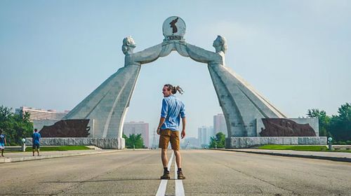 Louis Cole in front of the Arch of Reunification in North Korea. (Louis Cole/YouTube)