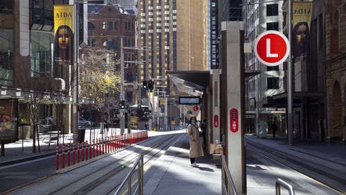 Commuters in the nearly empty Sydney CBD.