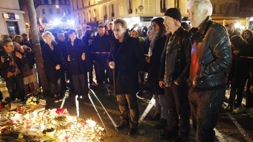 U2 cancelled its show and visited the Bataclan Theatre the day after the attacks. (AAP)