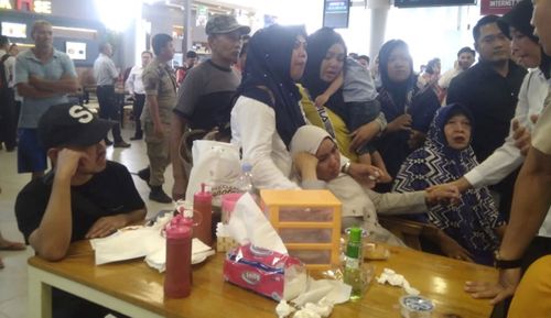 Relatives of the passengers aboard the Lion Air flight JT610, gather at Pangkal Pinang airport.