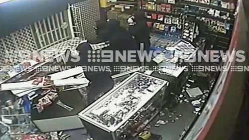 The thieves were trapped inside the store after the shopkeeper triggered an alarm. (9NEWS)