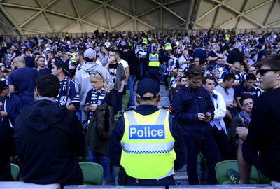 Police keep a close eye on the fans.