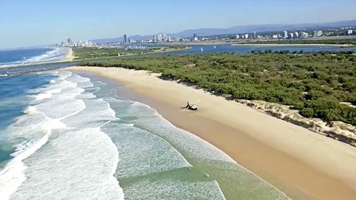 The trawler was attempting to travel through the Gold Coast seaway before it was pummelled by the waves.